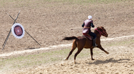 Shymkent, KAZAKHSTAN - 22 March 2017: Celebration of the Kazakh holiday NARIYZ. Archery from a horseのeditorial素材