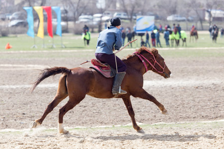 Shymkent, KAZAKHSTAN - 22 March 2017: Celebration of the Kazakh holiday NARIYZ. Archery from a horseのeditorial素材