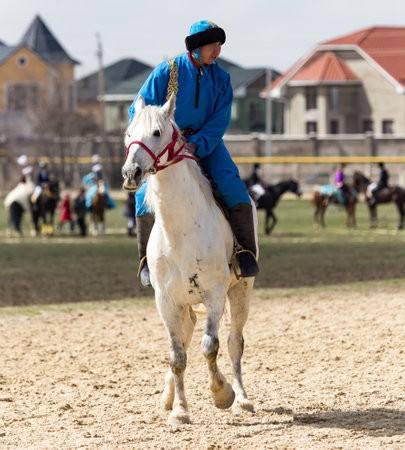 Shymkent, KAZAKHSTAN - 22 March 2017: Celebration of the Kazakh holiday NARIYZ. Competitions on horsesのeditorial素材