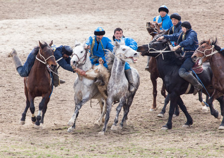 Shymkent, KAZAKHSTAN - 22 March 2017: Celebration of the Kazakh holiday NARIYZ. Competitions on horsesのeditorial素材
