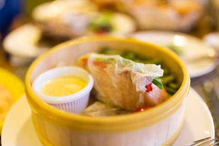 Fish with vegetables in a couple in a restaurant .の写真素材