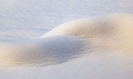 Beautiful snow on nature at sunset as backgroundの写真素材