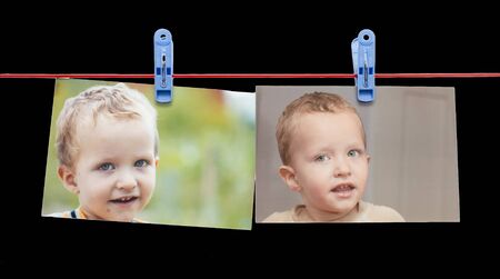 photo boy on a rope with clothespin on a black background .の写真素材