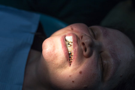 The dentist works with the client in the clinic .のeditorial素材