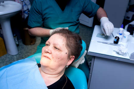 The dentist works with the client in the clinic .