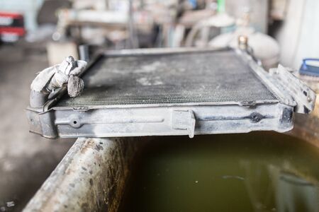 Repair old broken radiator auto in workshopの写真素材
