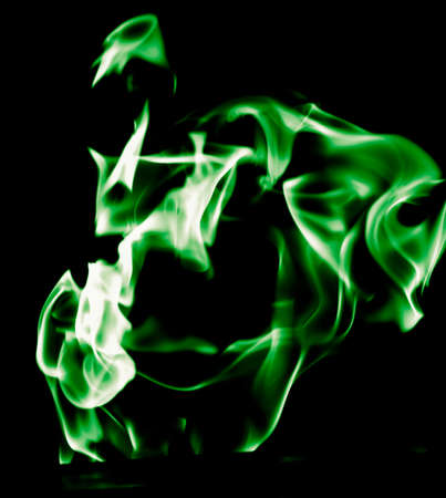 Green flame of fire on a black background .の写真素材