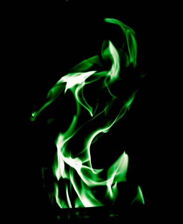 Green flame of fire on a black background .の写真素材