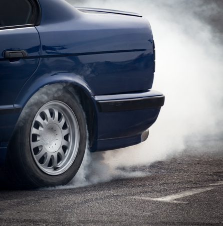 Smoke from under the wheels of the car .の写真素材