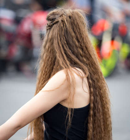 Long hair of a girl in the parkの写真素材