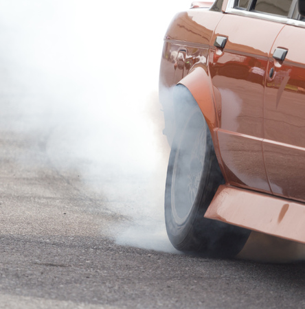 Smoke from under the wheels of the car .の写真素材