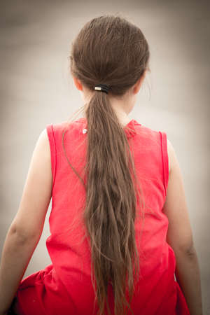 Long hair of a girl in the parkの写真素材