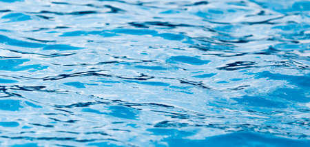 The smooth water in the pool as a background .の写真素材