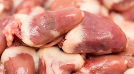 Chicken hearts for cooking as a backgroundの写真素材