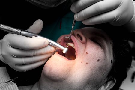 The dentist works with the client in the clinic .