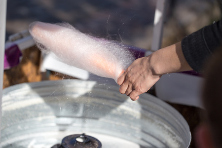 Cooking white sweet cotton wool from syrupの写真素材
