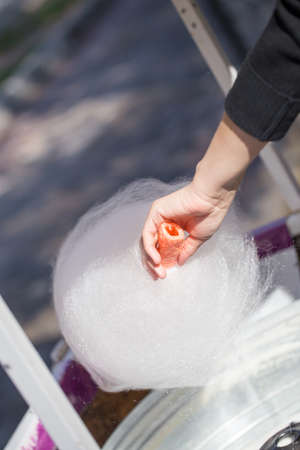 Cooking white sweet cotton wool from syrupの写真素材