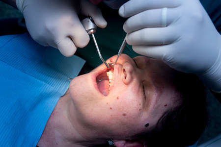 The dentist works with the client in the clinic .