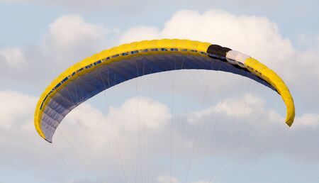 Extreme sport in the sky on a parachuteの写真素材