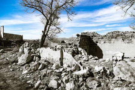 The ruins of an old house against the blue sky .の写真素材