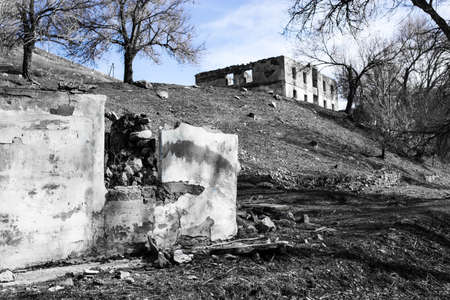 The ruins of an old house against the blue sky .の写真素材