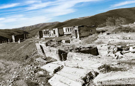 The ruins of an old house against the blue sky .の写真素材