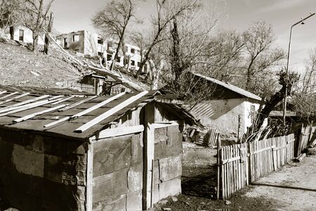 The ruins of an old house in nature .