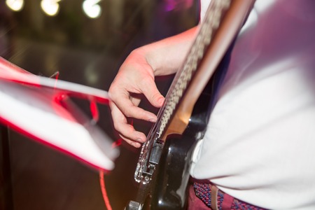 Musician playing guitar in a rock band .の写真素材