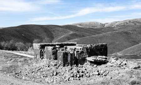 The ruins of an old house against the blue sky .の写真素材