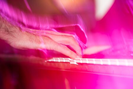 Musician plays keyboards in a rock band .の写真素材