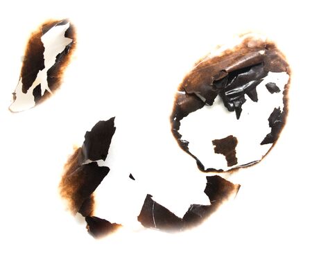 Trail of burnt paper on white background .