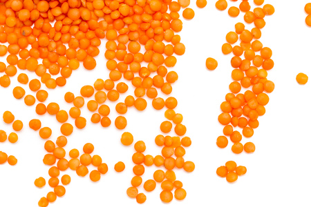 Red lentils on a white background. macroの写真素材