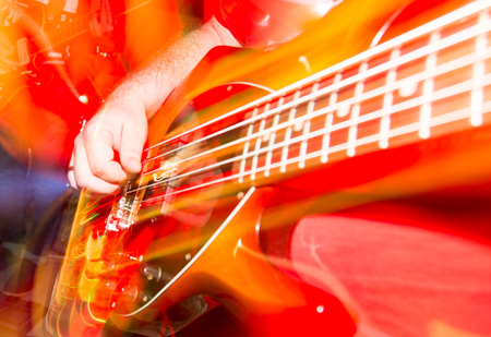 Musician playing guitar in a rock band .の写真素材