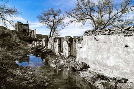 The ruins of an old house against the blue sky .の写真素材