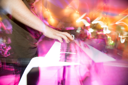 Musician plays keyboards in a rock band .の写真素材