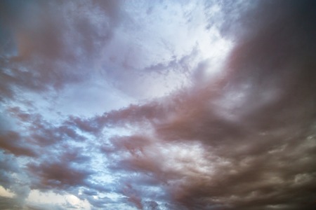 Background of beautiful rain clouds at sunsetの写真素材