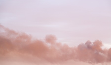 Background of beautiful rain clouds at sunsetの写真素材