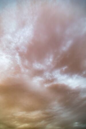 Background of beautiful rain clouds at sunsetの写真素材