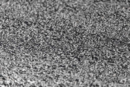 Old black asphalt on the road as background