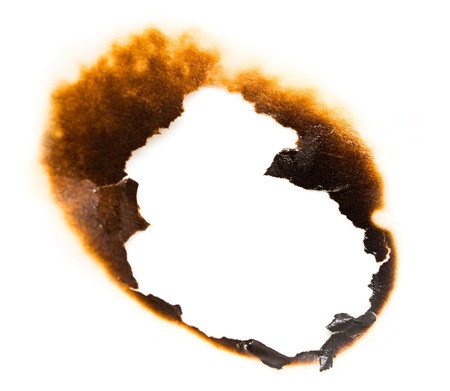 Trail of burnt paper on white background .の写真素材