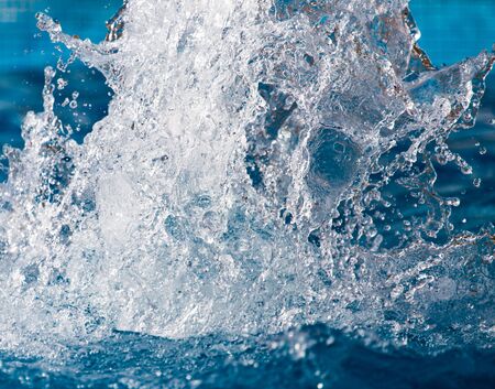 Splashing water in the pool as a background .