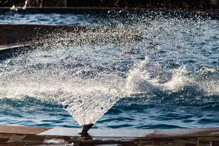 Splashing water in the pool as a background .の写真素材