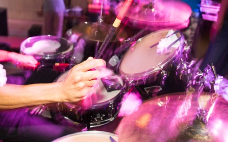 Musician plays drums in a rock band .の写真素材