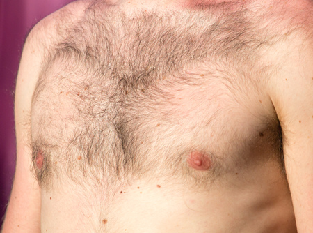 Hairy chest of a man in the open air .の写真素材