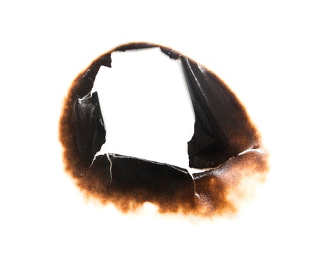 Trail of burnt paper on white background .の写真素材