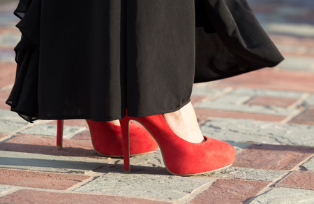 Legs of a girl in red hairpinsの写真素材