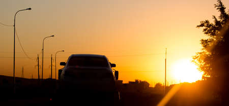 Road with moving auto on a yellow sunset .の写真素材