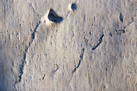 Old wall painted with lime as a background .