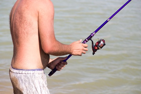 The man is fishing for the bait .の写真素材