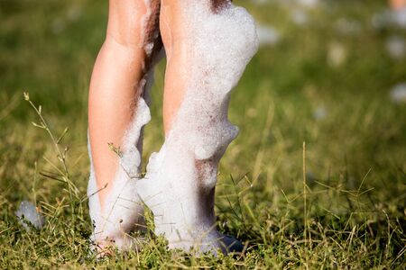 Youth at a foamy party on the beachの写真素材